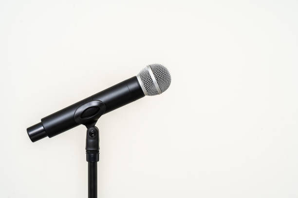 istock Microphone with stand on isolated white background for singer and speaker. Wireless microphone. High quality dynamic microphone 1495047526