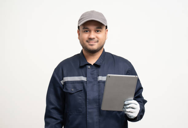 istock Technician workers in uniform maintenance service with tablet. Profession of service industry house repair. Home services isolated background. 1495048074