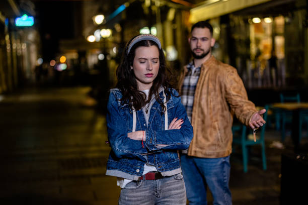 istock Young couple's disagreement unfolds on a lively promenade 1495050841