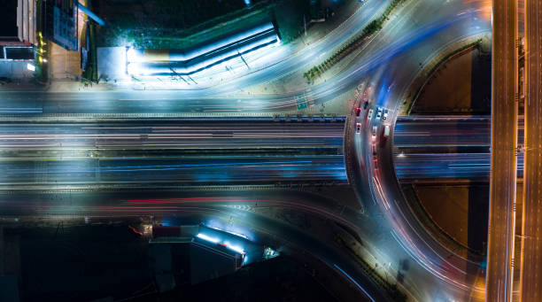 istock Expressway top view, Road traffic an important infrastructure, car traffic transportation above intersection road in city night, aerial view cityscape of advanced innovation, financial technology 1495051865