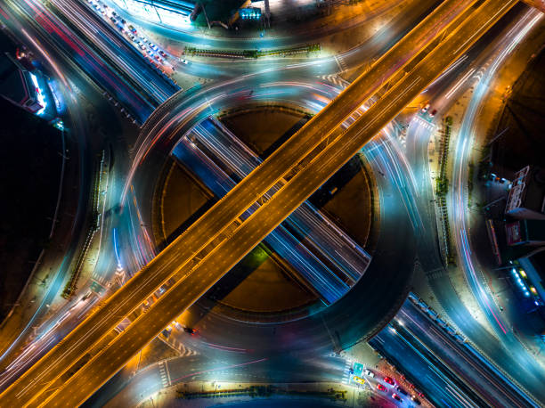 istock Expressway top view, Road traffic an important infrastructure, car traffic transportation above intersection road in city night, aerial view cityscape of advanced innovation, financial technology 1495051870