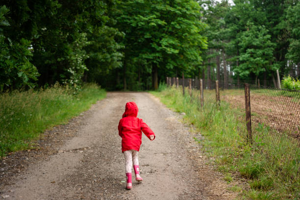 istock Child running in public park 1495052745
