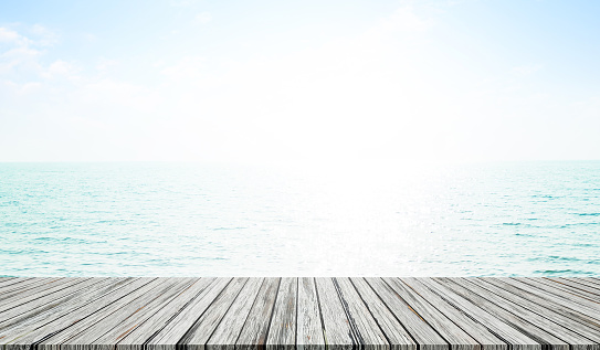 Table Summer Background,Top Deck Wooden on Sea with White Sun,Tropical Nature Sea Beach Space Blue Water Ocean and Blue Sky at Coast,Tabletop on blur View  Seascape Horizon,Empty Mockup Scene Counter.