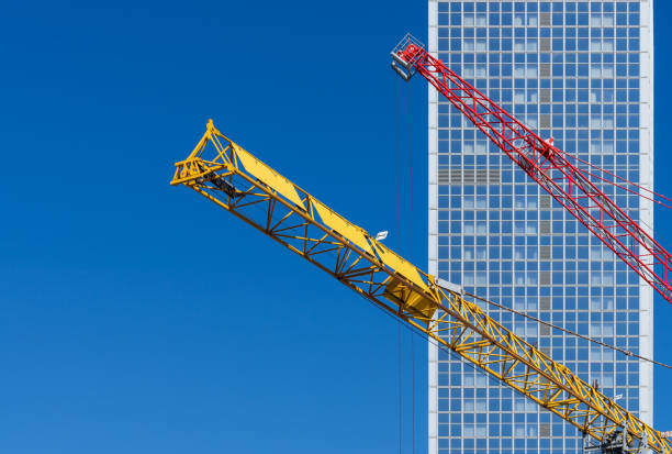 istock Low Angle view of crane against skyscraper 1495056670