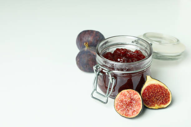 istock Jar with fig jam and ingredients on white background 1495058399