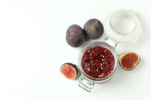 istock Jar with fig jam and ingredients on white background 1495058599