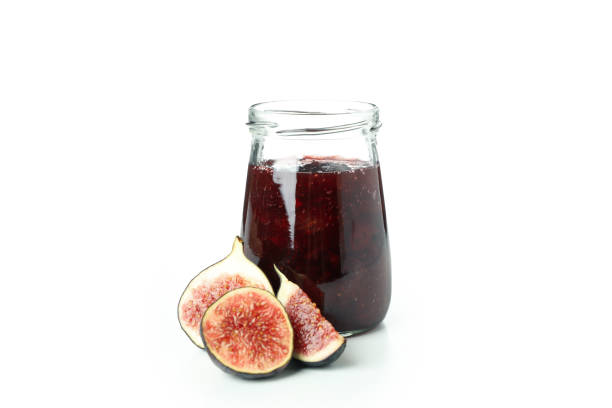 Fig jam and ingredients isolated on white background