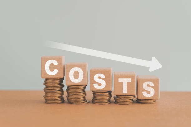 istock Cost wording on decreasing stack of coins stacking with white down arrow for cost reduction concept which effect to product cost , profit , inflation and economy recession concept 1495060272