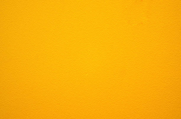 黄色い壁のテクスチャ背景。石垣の表面はエナメル塗料で塗装されています。 - tinge ストックフォトと画像
