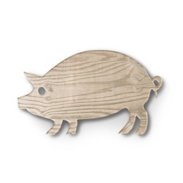 istock Close up view wooden cutting board with pig shape fit for kitchen concept. 1495063505