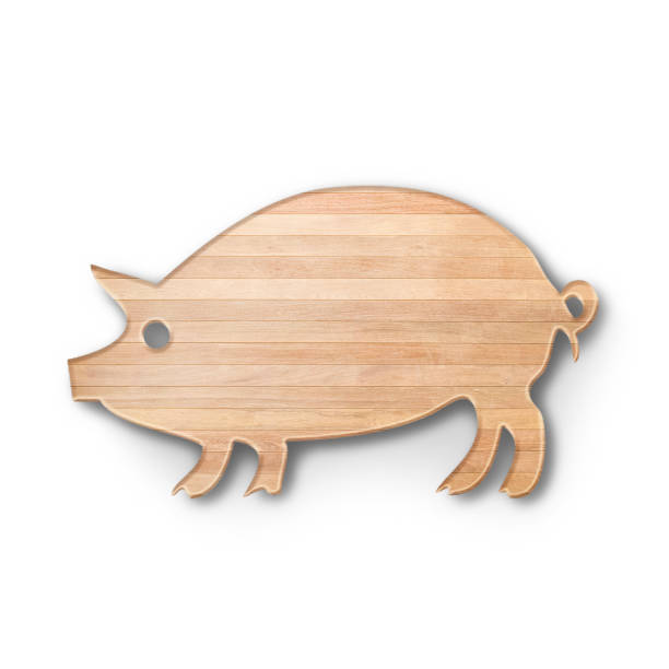 istock Close up view wooden cutting board with pig shape fit for kitchen concept. 1495075071