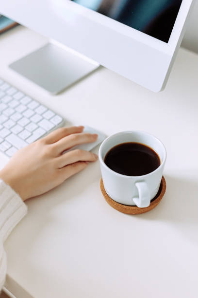 istock Business concept Woman typing on computer with coffee on office table 1495076258