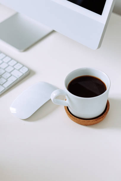 istock Business concept Woman typing on computer with coffee on office table 1495076270