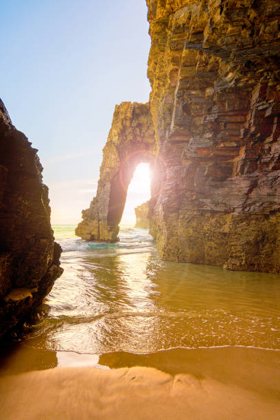 istock Natural rock arches on Cathedrals beach in low tide- Galicia, Spain 1495076297