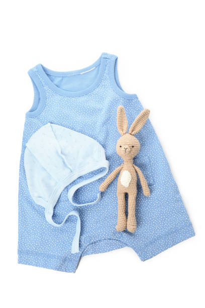 istock Baby clothes and toy rabbit isolated on white background 1495077268