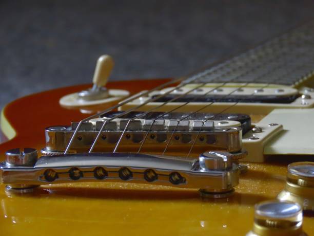istock Dusty old LP style guitar in a dimly lit room 1495077600