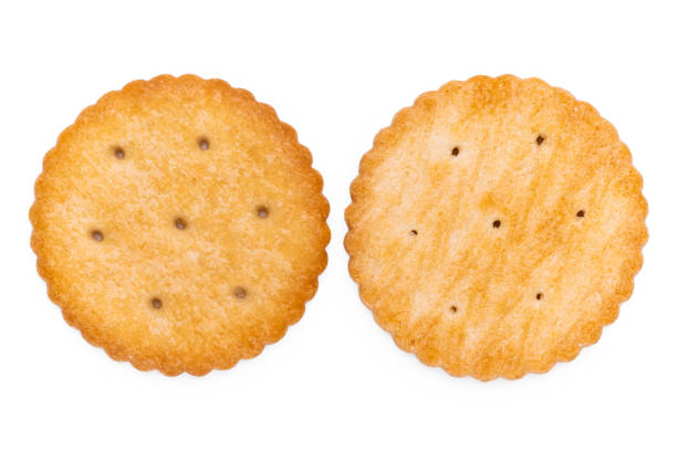 istock Healthy whole wheat cracker on white background. Stack of Saltine crackers isolated on white background. Round crackers. 1495079143