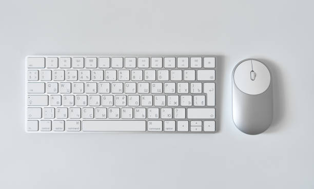 istock Office table desk. Workspace with sketchpad, keyboard, office supplies, pencil, on white table. 1495079585