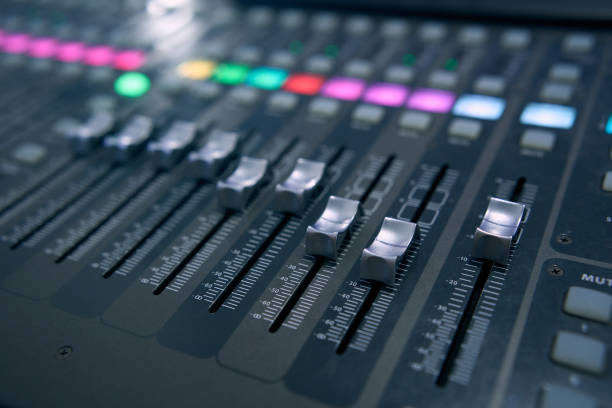 istock Professional audio mixing console. ​Mixer. Pro audio mixing board faders and knobs. Static shot of multi-track music recording equipment faders and sliders. 1495079629