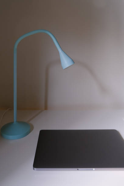 istock minimal interior with lamp and laptop at the desk 1495084266