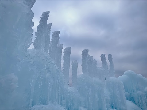 Frozen icicles formed into ice castles. Outdoor in winter
