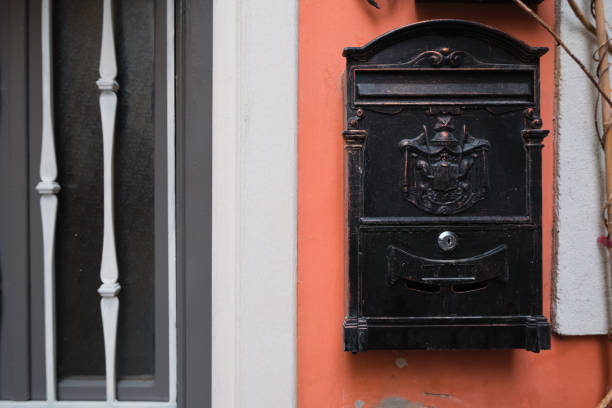 istock old mailbox on the wall near the door. vintage postbox. 1495084654