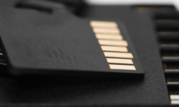 istock Back side of black SD memory card. Computer equipment. Memory card backup 1495084903