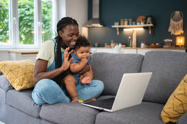 Mother and baby boy Black ethnicity on a video call stock photo