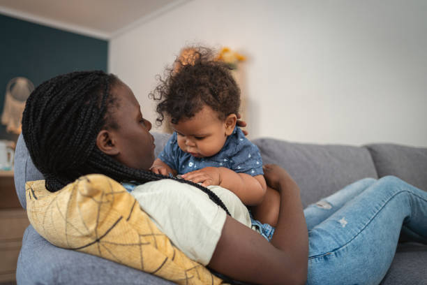 istock Mother and baby boy Black ethnicity on the sofa 1495086177