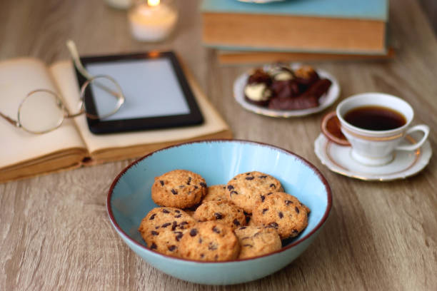 istock Books, Glasses, Tablet, Tea, Chocolate, Cookies and Candles 1495089829