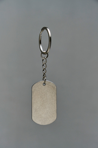 Metal keychain on a gray background