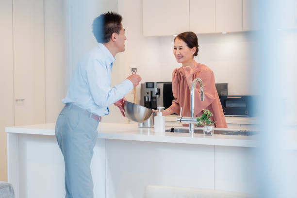 istock Senior couple enjoying cooking together in the kitchen 1495091688