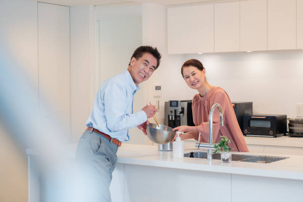 istock Senior couple enjoying cooking together in the kitchen 1495091690