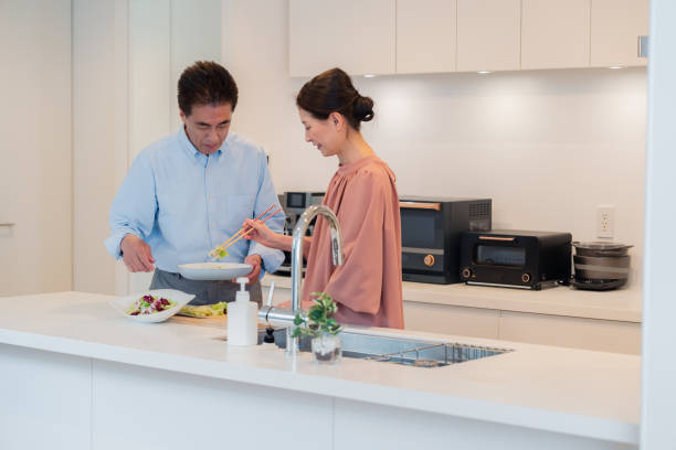 istock Senior couple enjoying cooking together in the kitchen 1495091707