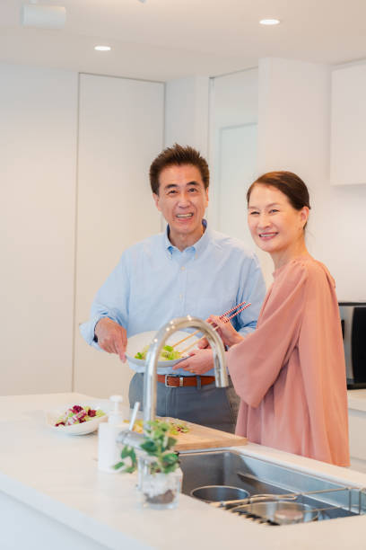 istock Senior couple enjoying cooking together in the kitchen 1495091722