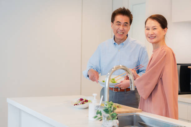 istock Senior couple enjoying cooking together in the kitchen 1495091732