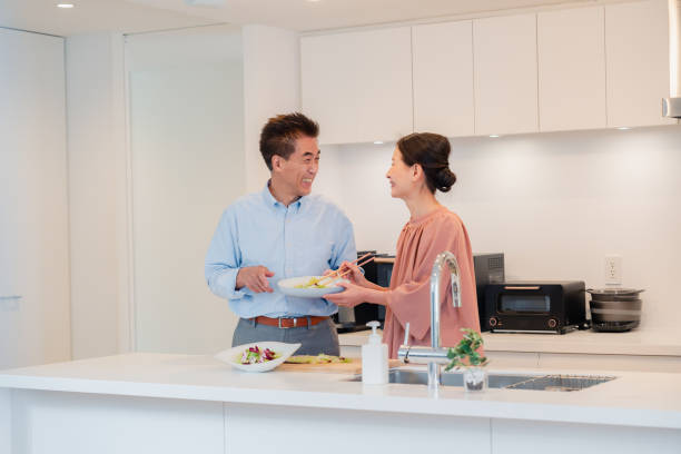 istock Senior couple enjoying cooking together in the kitchen 1495091744