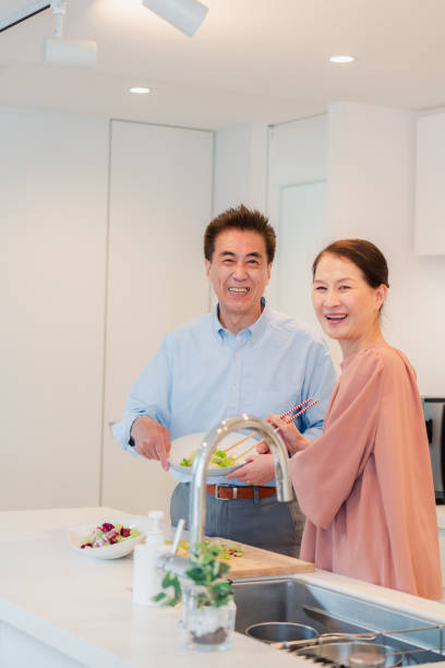 istock Senior couple enjoying cooking together in the kitchen 1495091772