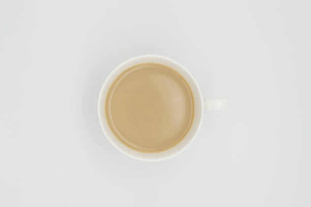 istock white porcelain coffee cup with cappuccino top view on white background 1495093580