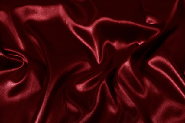 istock Silk fabric, abstract wavy red satin fabric background. 1495095799