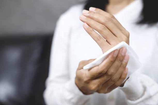 istock woman using tissue paper Clean your hands to remove germs. 1495096879
