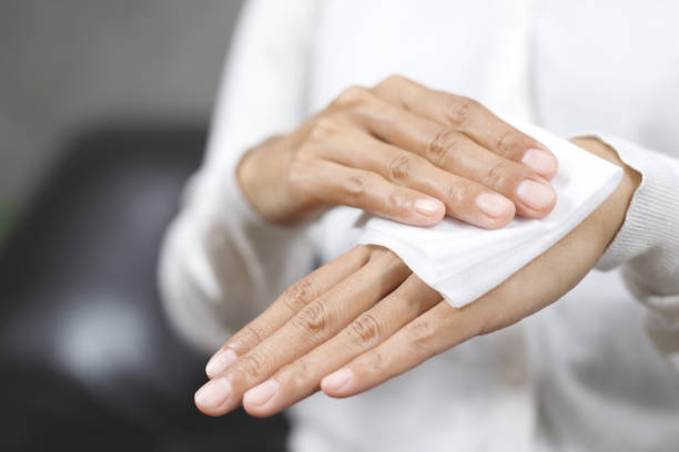 istock woman using tissue paper Clean your hands to remove germs. 1495096881