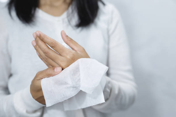 istock woman using tissue paper Clean your hands to remove germs. 1495097062