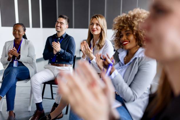 istock Beautiful people applauding at a conference 1495097350