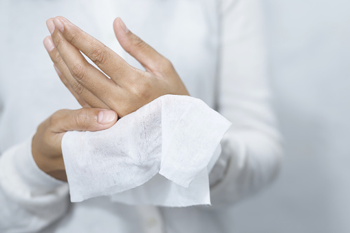 woman using tissue paper Clean your hands to remove germs.