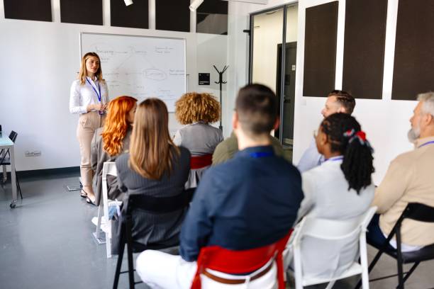 istock Business people listening to a speech 1495097446