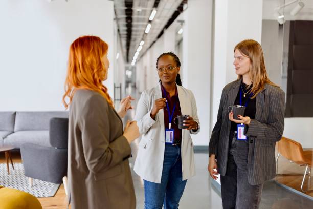 istock Businesswomen talking in the modern office 1495097502