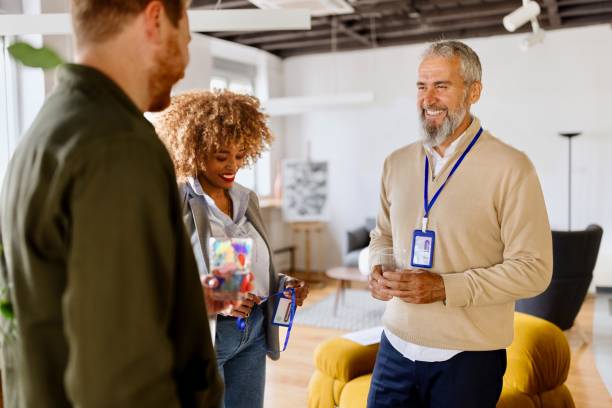 istock Multiracial colleagues talking in the modern office 1495097520