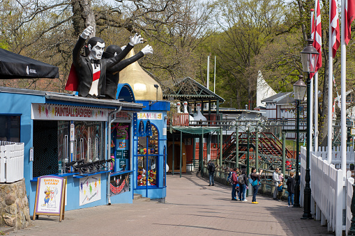 Copenhagen, Denmark - May 1, 2022: People at Bakken, the oldest amusement park in the world.