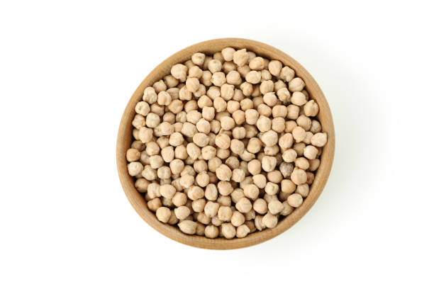 istock Wooden bowl of chickpeas isolated on white background 1495100663